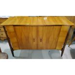 A mid 20th century Everest teak sideboard with serpentine front tapering legs, patinated inlay to