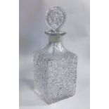 Geoffrey Baxter for Whitefriars, a square clear glass "bark" decanter with a tab stopper.
