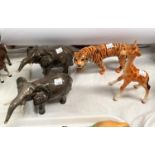 A Beswick Tigeress 1486, a Beswick giraffe 853, two Beswick elephants 974 (1 tusk a.f)