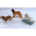 Three Beswick dogs, Afgan Hound 2285, King Charles Spaniel 2107 and Poodle on Cushion 2985