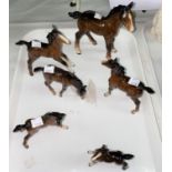 Six Beswick brown foals of various sizes