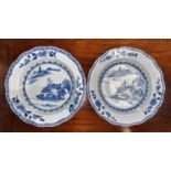 A pair of 18th century Chinese blue and white shallow dishes with traditional mountain scenes,