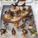 A Beswick bird stand and a large collection of Beswick birds (15)