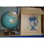 A vintage light up table top globe