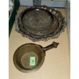 A Tibetan bronze ceremonial bowl with tapering handle, inscription to rim, 22cm, a middle eastern