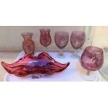 A Murano style glass dish in the form of lips, a selection of cranberry coloured glassware and a