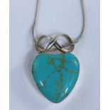 A modern white metal heart pendant set with a turquoise coloured stone, stamped 925.