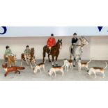 A Beswick hunting group: Huntsman 1501, Huntswoman 1730, Girl on Pony 1499, and Boy on pony 1500,