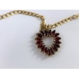 A 9ct gold garnet set heart shaped pendant on a yellow metal flat link chain stamped 9kt weight 10.
