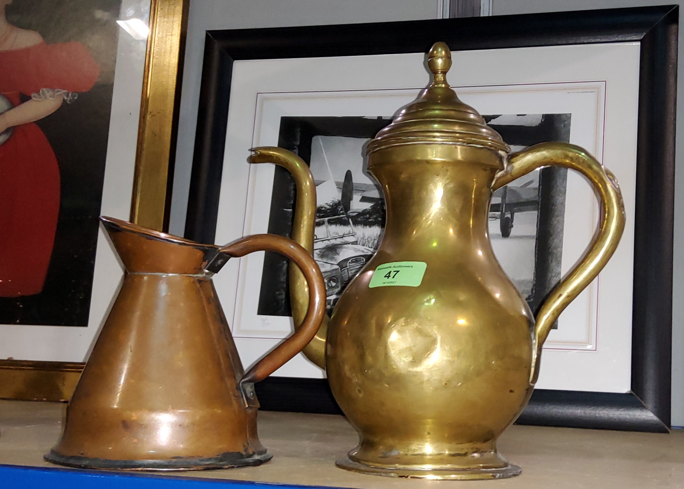 A Middle Eastern brass tea pot and a conical copper jug