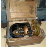 A wooden cased Evershed and Vignoles hand generator