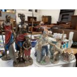 A pair of Bronzed resin Leonardo Masai figural groups of father & son and mother & daughter,