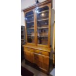 A Victorian walnut full height bookcase with 2 glazed doors over 2 drawers and double cupboard,