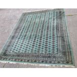 A very large modern Middle Eastern elephant foot pattern carpet of green ground 360 x 281cm