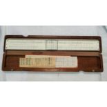 A DIWA slide rule in original beechwood case, 31cm overall