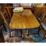 A reproduction oak dining suite with linen fold decoration comprising refectory table; 6 ladder back