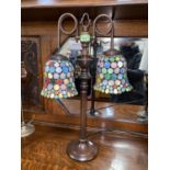 A classical style bronzed table lamp with two 'Smarties' style glass Tiffany style shades to