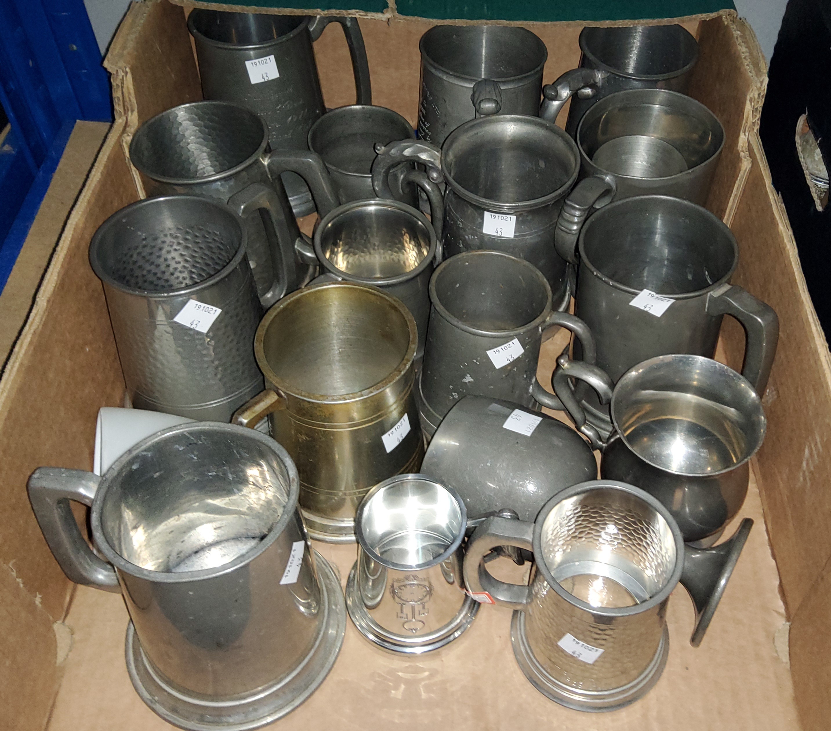 A collection of various pewter tankards etc