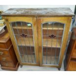 A oak leaded glass door display cabinet, length 80cm and height 105cm