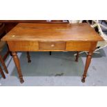 A Victorian style stripped pine desk with single drawer on turned legs