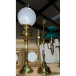 A brass oil lamp on reeded column; an Edwardian style brass desk lamp with green shade