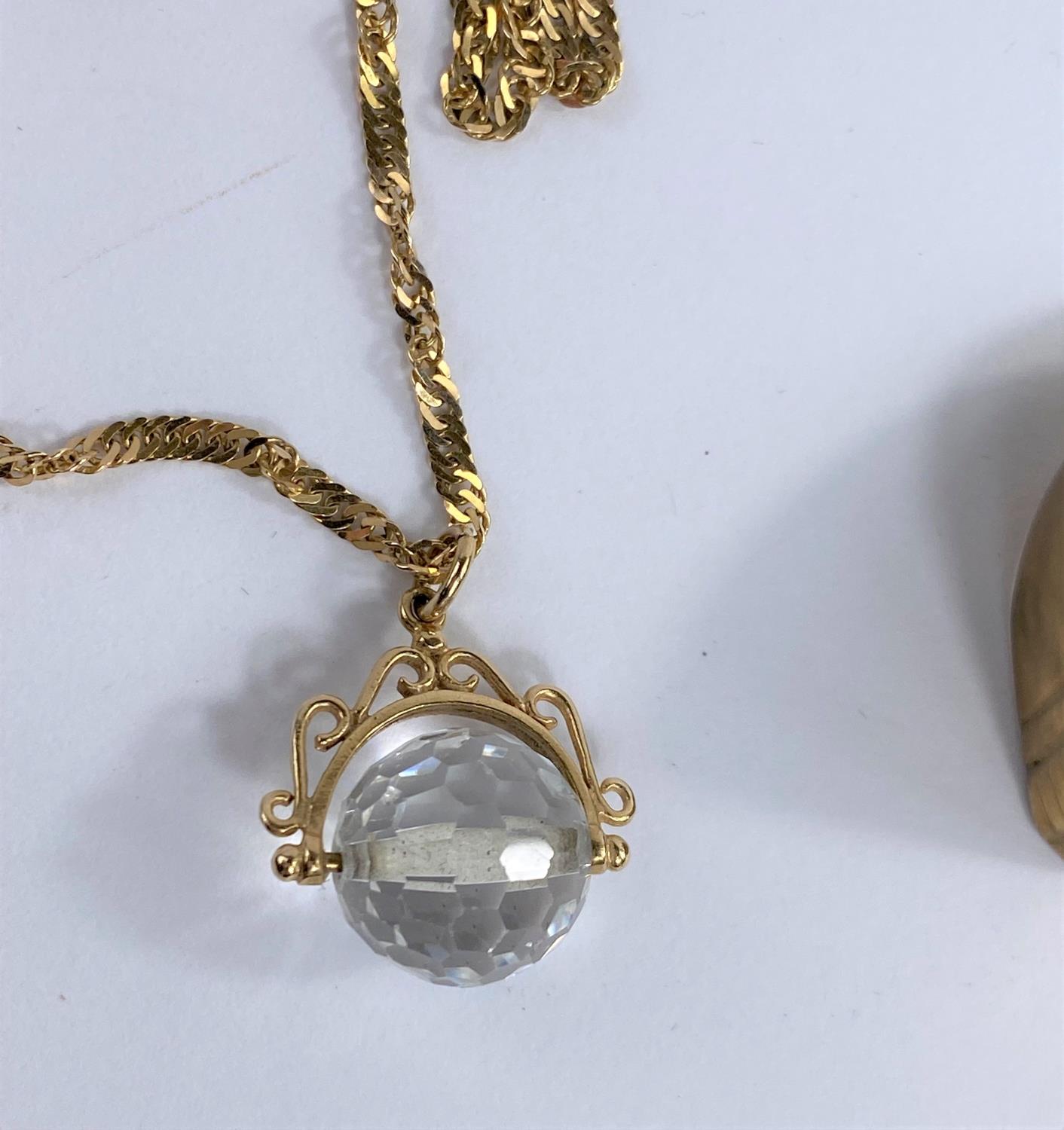 A 9ct gold chain with faceted crystal glass ball pendant gross weight 7.2 gms and a brass gents - Image 2 of 2