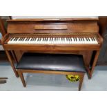 A modern small walnut cased piano, iron framed and overstrung, with duet stool