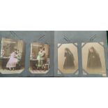 An early 20th century album of picture postcards WWI period and later including a pair of