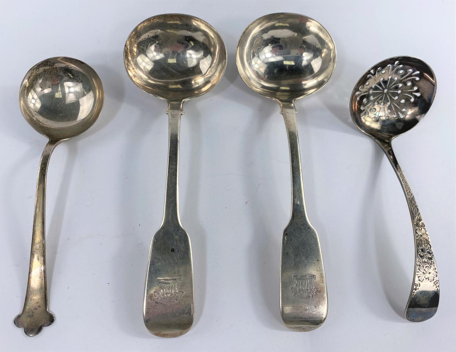 A hallmarked silver pair of Old English pattern sauce ladles, monogrammed, Exeter 1842; another