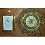 A reproduction carriage clock and a wall clock
