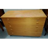 A modern lightwood chest of 5 drawers