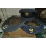 A 1950's RAF cap and two berets, with badges and box.