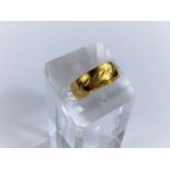 A 22ct hallmarked gold wedding ring 5.7gms. size Q/R
