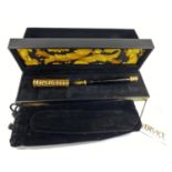 A boxed Versace fountain pen made by Omas with gilt crocodile skin effect highlights on lid and