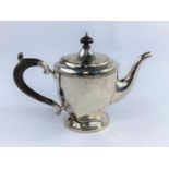 A three piece hall marked silver tea service bearing monogram and date, having teapot, milk jug