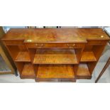 A Strongbow reproduction breakfront side cabinet with drawers and shelves below, length 115cm and