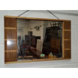 An Art Deco style rectangular mirror with light wood and dark wood frame, with rounded edges, 42 x