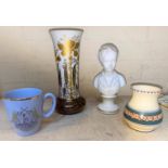 A modern Limoges Paronware style bust of a young boy and a classic resin Handgemalt vase with flared