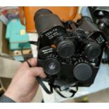 A pair of ZENITH 10 x 50 binoculars in leather case with Sci outer box; a pair of REVUE zoom