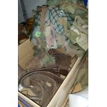 A WWII camouflage tin helmet; leather gaiters; etc.