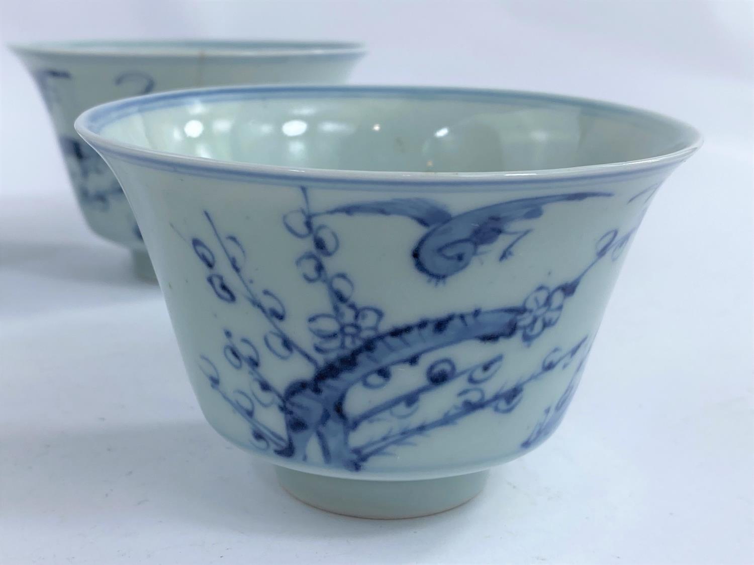 Four Chinese blue and white tea bowls with Prunus blossom decoration with birds, a character mark to - Image 2 of 4