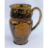 An unusual early 20th century Royal Doulton pottery jug decorated with cats etc. in black against an