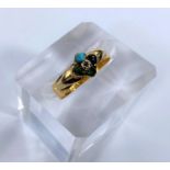 A 22 carat hallmarked gold dress ring set with a turquoise and 4 other colour stones, with letters