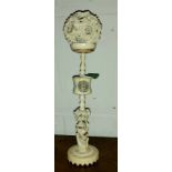 A early 19th century Chinese carved ivory puzzle ball with figural column, (a.f)
