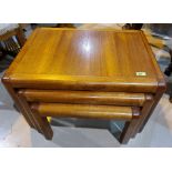 A mid 20th century teak nest of three tables with rounded corners, largest length 69cm