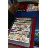 A World selecion of stamps collected into albums and stock books, unsorted tin of stamps etc