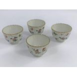 Four Chinese tea bowls of ribbed form decorated in polychrome with detailed flowers and insects,