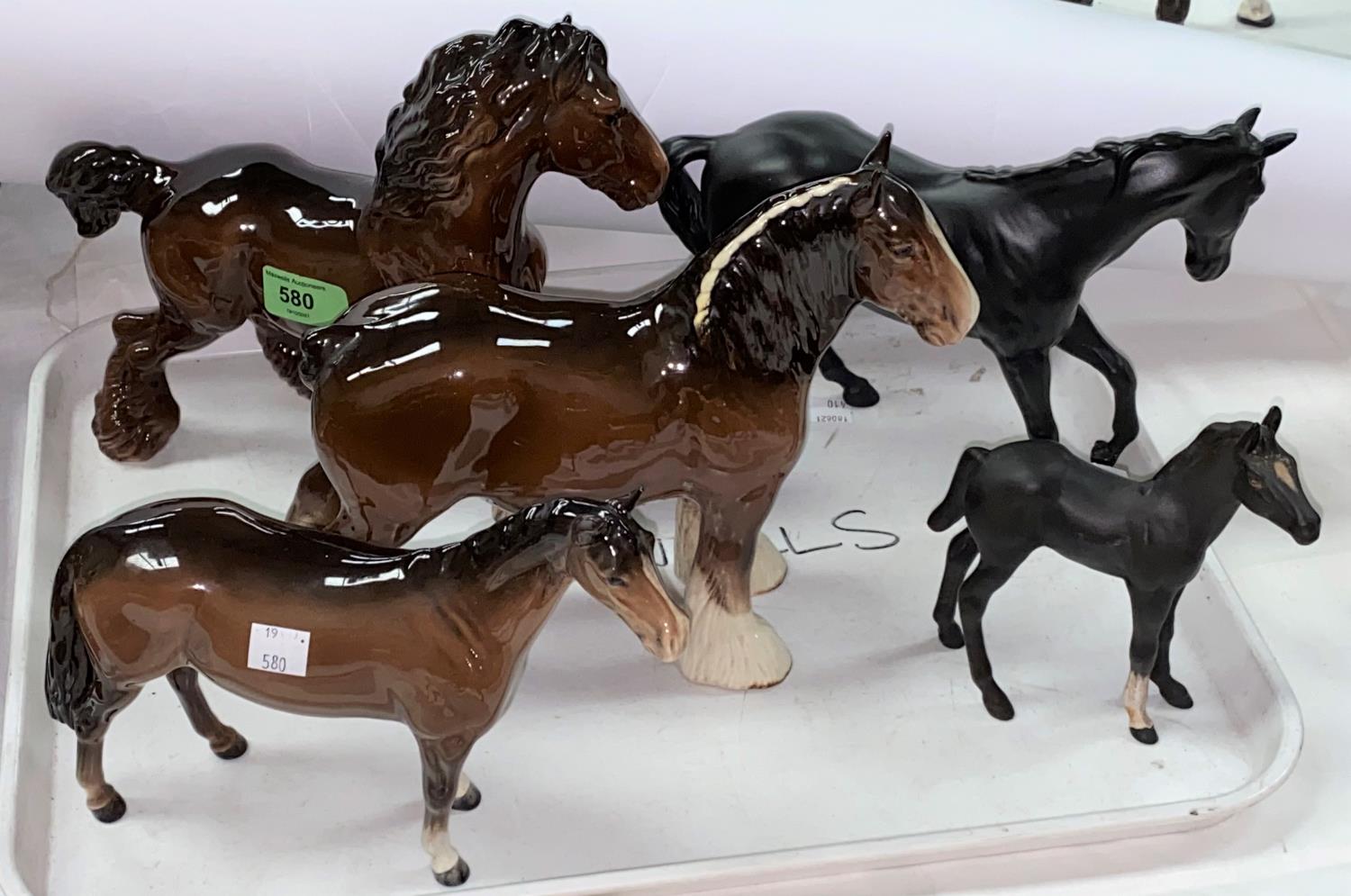 Two Beswick Shire horses 818 and 975, a Beswick Huntsman horse 1484, a Beswick Black Beauty and a