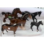 Two Beswick Shire horses 818 and 975, a Beswick Huntsman horse 1484, a Beswick Black Beauty and a