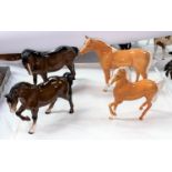 Four Beswick horses: Arab "Bahram" Palamino 1771, a Stocky Jogging mare 855, mare 976 and A prancing